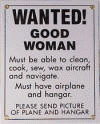 Wanted! Good Woman Sign - Must Have Airplane - Novelty/Humorous - Metal Collector Sign - AVW0417